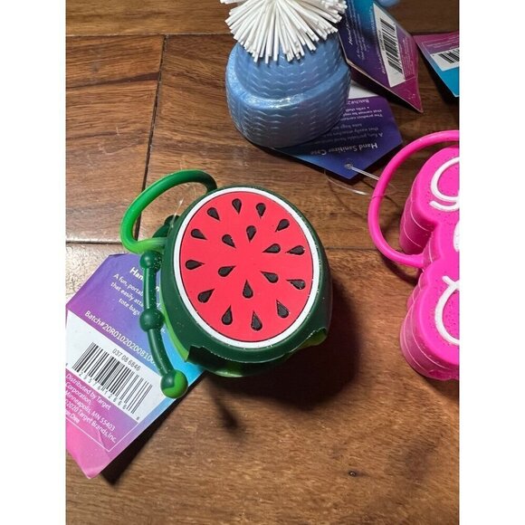 Lot of 6 hand sanitizer cases.   Good vibes, cupcake, penguin, melon - Picture 2 of 7